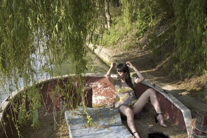 Cute chick is naked by the river photo 18