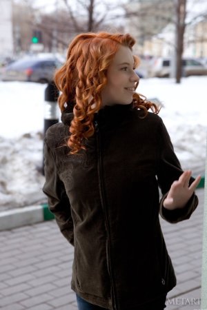Ginger chick shows hairy pussy on floor. photo 7