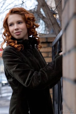 Ginger chick shows hairy pussy on floor. photo 8