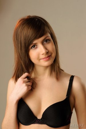 Petite brunette is doing sexy poses photo 14