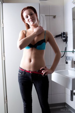 Ginger babe is naked on the sofa photo 10