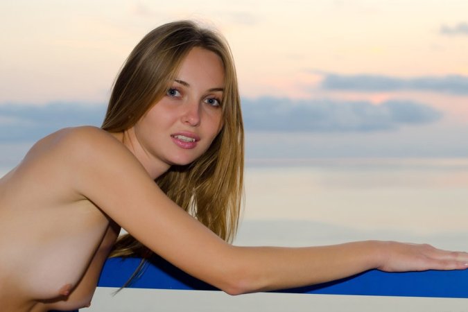 Naked babe stretches her skinny body on balcony. photo 10