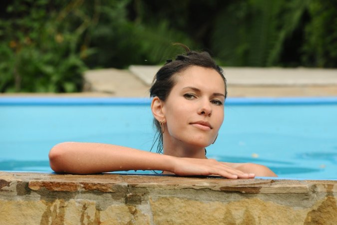 Cooling down by the pool with some naked fun photo 14