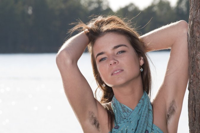 Gorgeous brunette flaunts her flowery hairy vagina photo 2