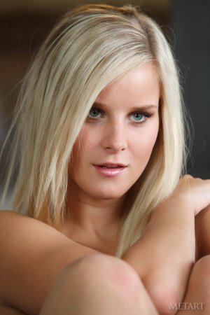 Appetizing blonde gazing into tiny air while exposing photo 5