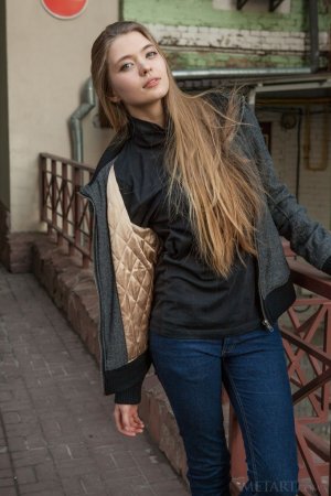 A tall blonde woman walks around the town photo 16