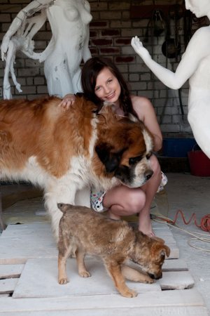 Tiny babe is playing with her dog photo 2