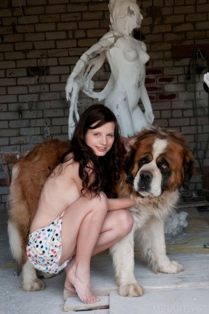 Tiny babe is playing with her dog photo 5