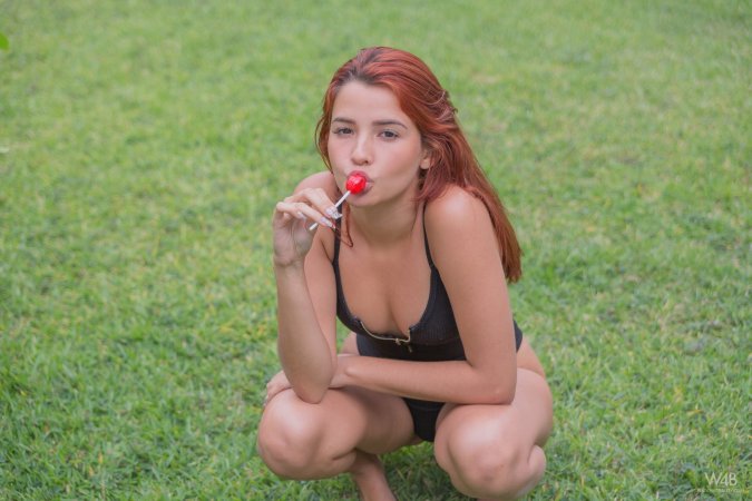 Sticky lollipop deep inside a ginger pussy photo 18