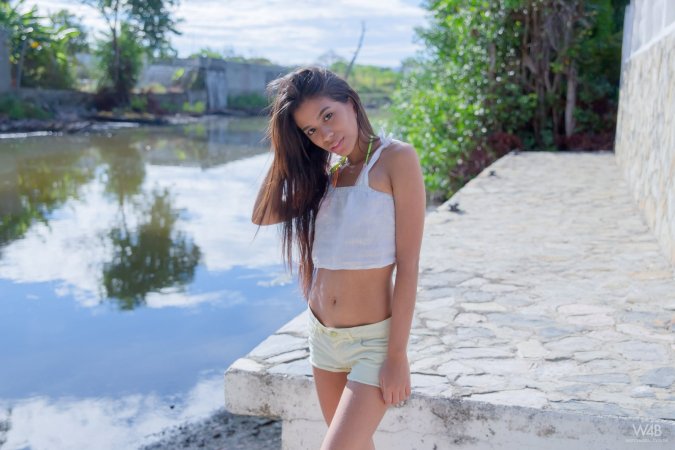 Hottie undresses right in the middle of the street photo 9
