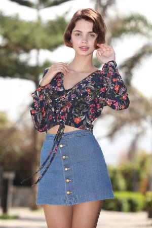 Brunette undresses during a long walk along the city photo 1