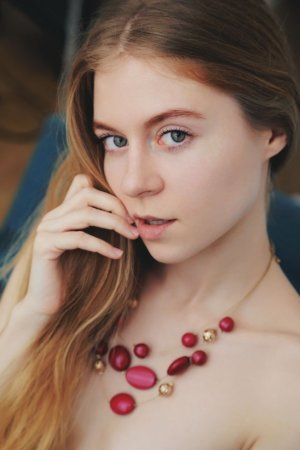 Petite ginger teen model is stripping and hotly posing photo 8