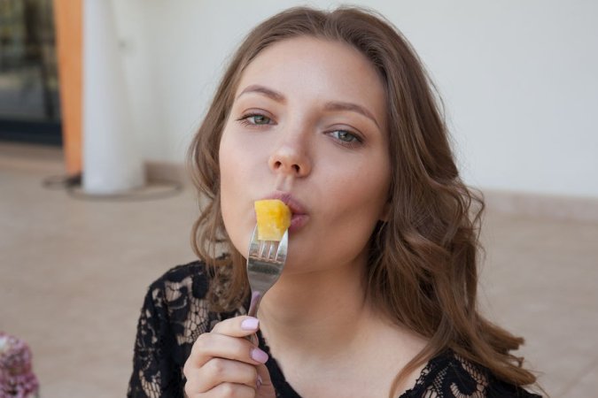 Brunette eats cake and teases her clit on the porch photo 17