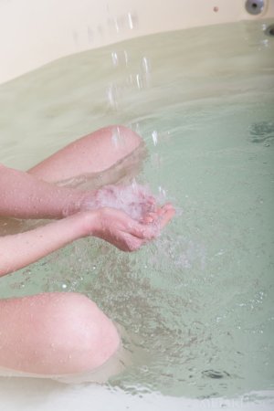 Playful babe teases pussy in jacuzzi photo 3