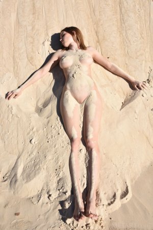 Naked brunette turns desert into her own sandbox photo 4