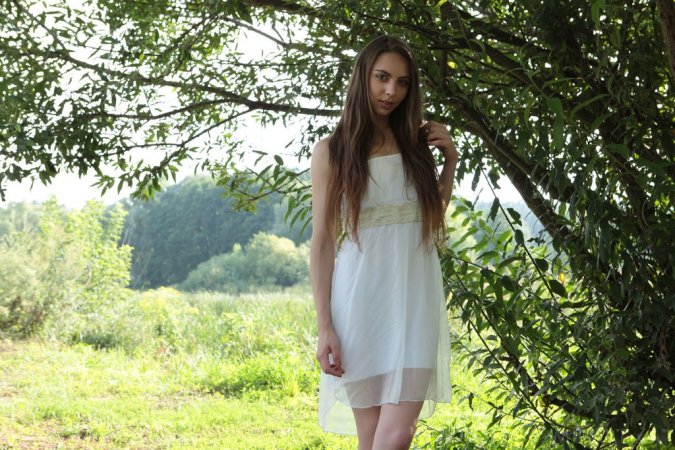 Naked cutie relaxes under warm sun photo 20