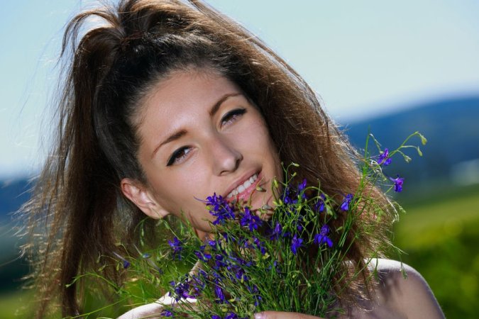 Cutie gets orgasms in field flowers photo 9