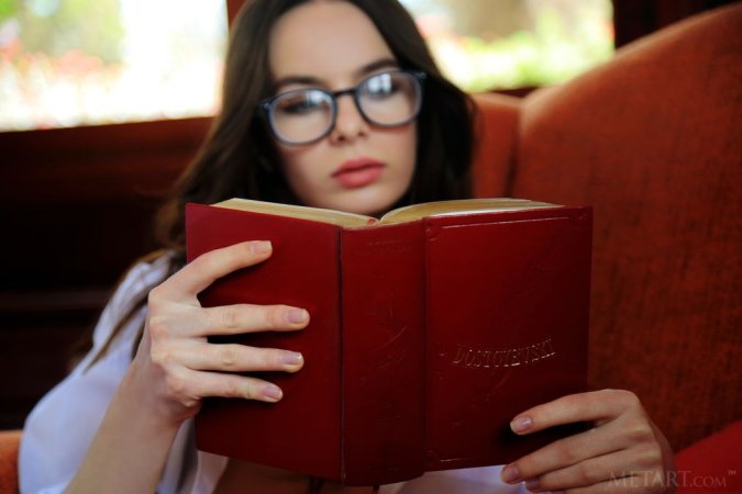 Book-lover masturbates in the armchair photo 1