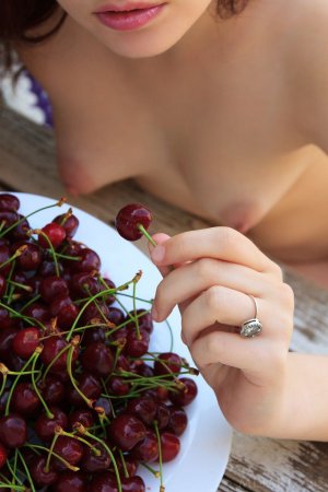 Sweetie caresses her tits and pussy with cherries photo 7