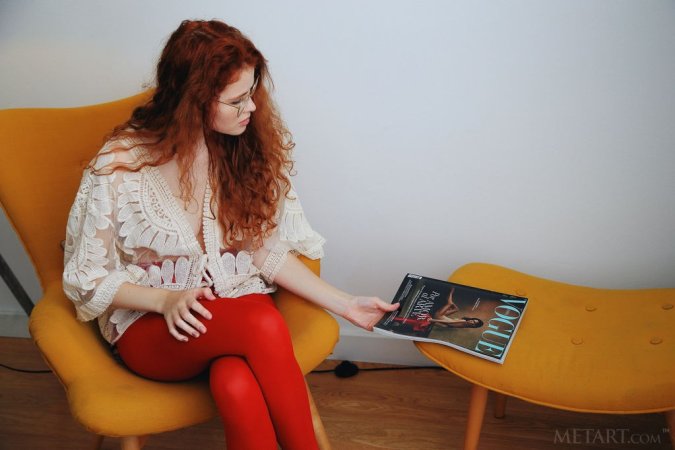 Ginger babe explores her sweet pussy in armchair photo 20