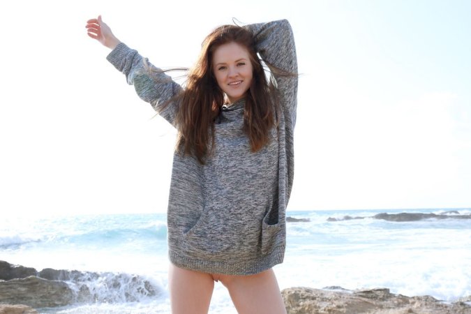 Hot babe orgasms at the seaside photo 11