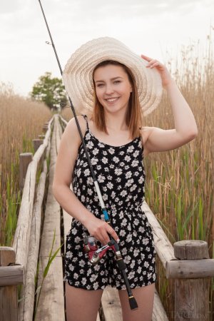 Sweetie goes fishing totally naked photo 3