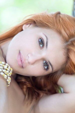 Ginger cutie squeezes boobs under tree photo 15