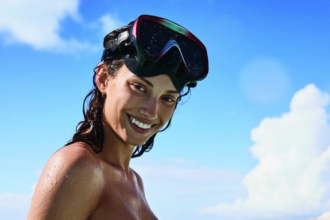 Tanned hottie works out on the beach and in sea photo 7