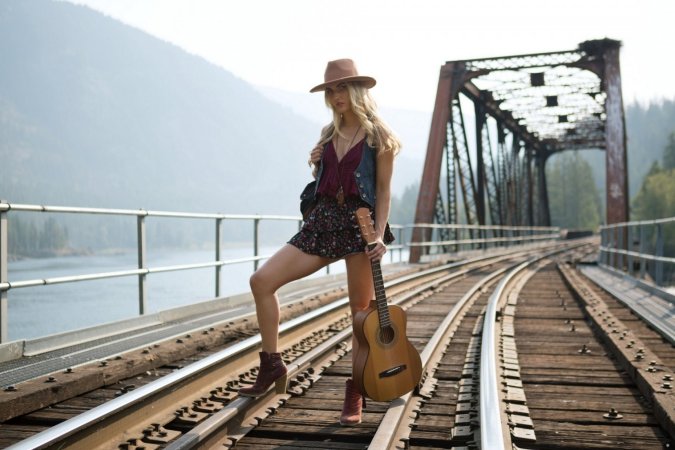 Naked blonde plays guitar and her own pussy on the road photo 17