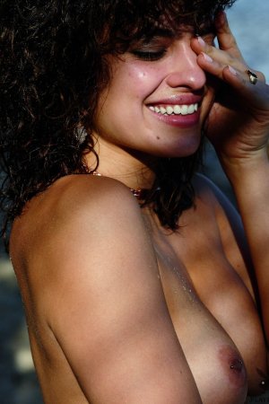 Naked babe gets orgasms on beach and in sea photo 1