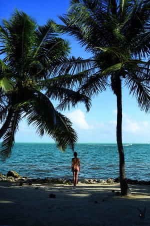 Naked babe gets orgasms on beach and in sea photo 5