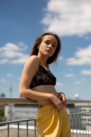 Skinny brunette works out totally naked on the roof photo 2