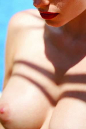 Slim but busty brunette spends vacation naked photo 11