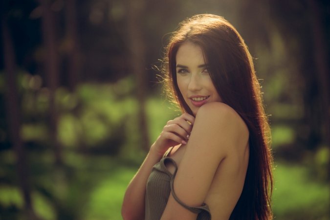 Cameraman follows naked brunette into the forest photo 8
