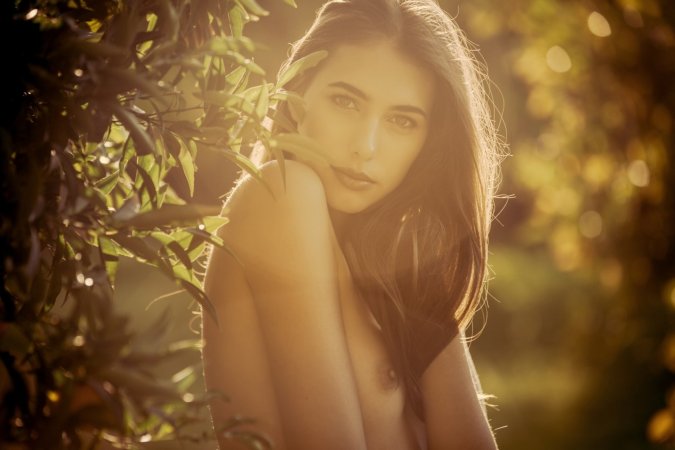 Hottie masturbates in green grass photo 10