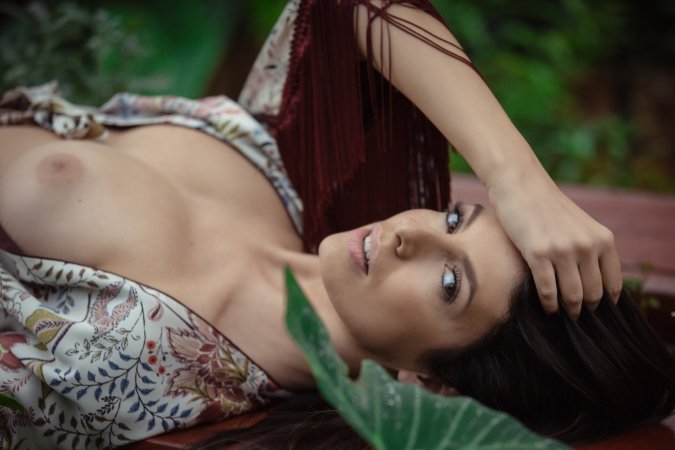 Excited babe plays with cunt in the garden photo 7