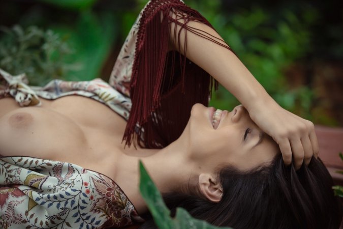 Excited babe plays with cunt in the garden photo 17