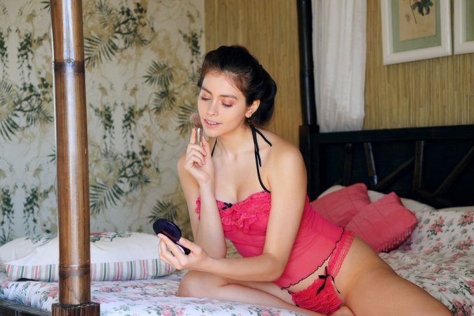 Foxy Alissa teases with a slow striptease photo 2