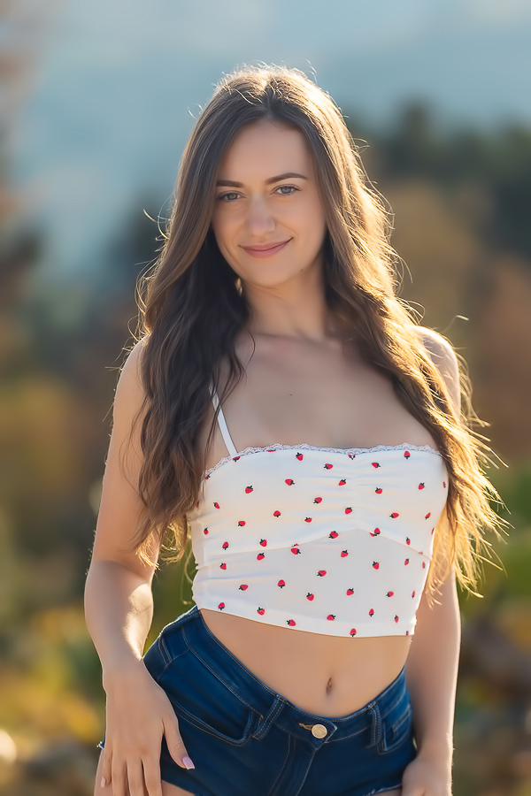 Audrey Sterling lies barefoot on a blanket