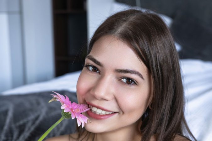 Sooky poses with flowers shaving her pussy photo 7