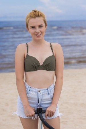 Erika Fox showing off her tan lines by the water photo 1