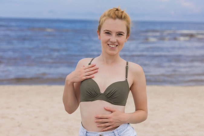 Erika Fox showing off her tan lines by the water photo 3