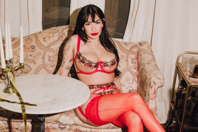 Sabina Magic teases on a vintage armchair for a solo fantasy photo 2