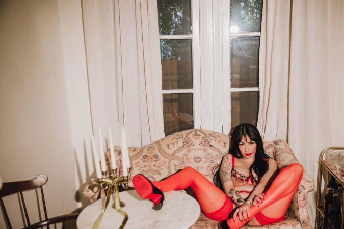 Sabina Magic teases on a vintage armchair for a solo fantasy photo 6