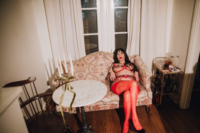 Sabina Magic teases on a vintage armchair for a solo fantasy photo 7