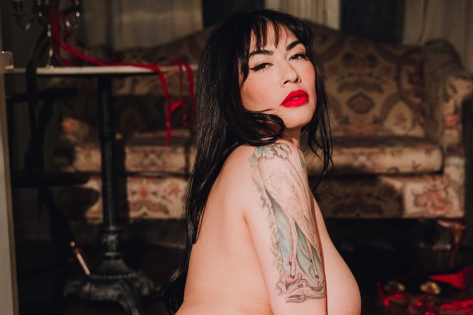 Sabina Magic teases on a vintage armchair for a solo fantasy photo 20